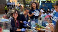IHN personnel sharing nutrition tips and delicious food at the VP&S curiosity cube event.